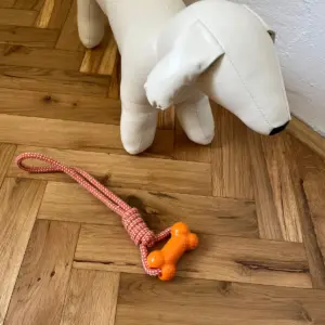 Přetahovadlo pro psy s gumovou kostí a pevným lanem, 31 cm, oranžové